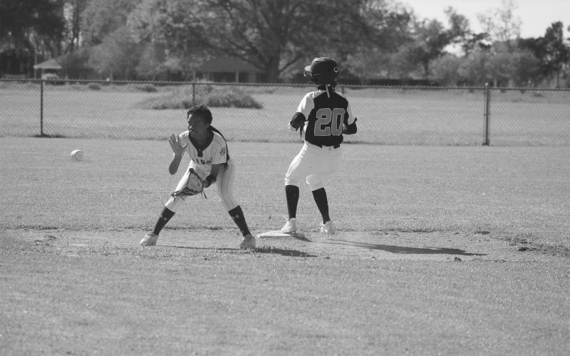 Pine Prairie’s Sydney Fontenot (20) advances to second base ahead of a throw to Ville Platte’s Janiah Leday. (Gazette photo by Tony Marks)
