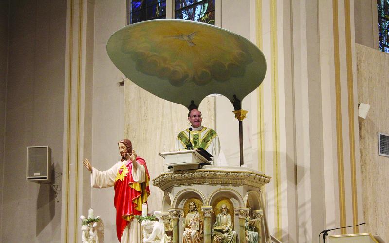 Fr. Tom Voorhies, pastor of Sacred Heart of Jesus Catholic Church  in Ville Platte, served as the celebrant for the Mass held Tuesday, September 8. Fr. Voorhies is pictured as he delivers the homily.