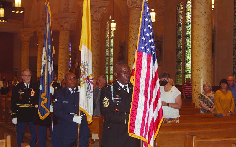 Members of the St. Landry Parish Veterans Honor Guard process with the colors inside St. Landry Catholic Church in Opelousas for the annual Memorial Mass for Fr. Verbis LaFleur, Servant of God. (Gazette photos by Tony Marks)