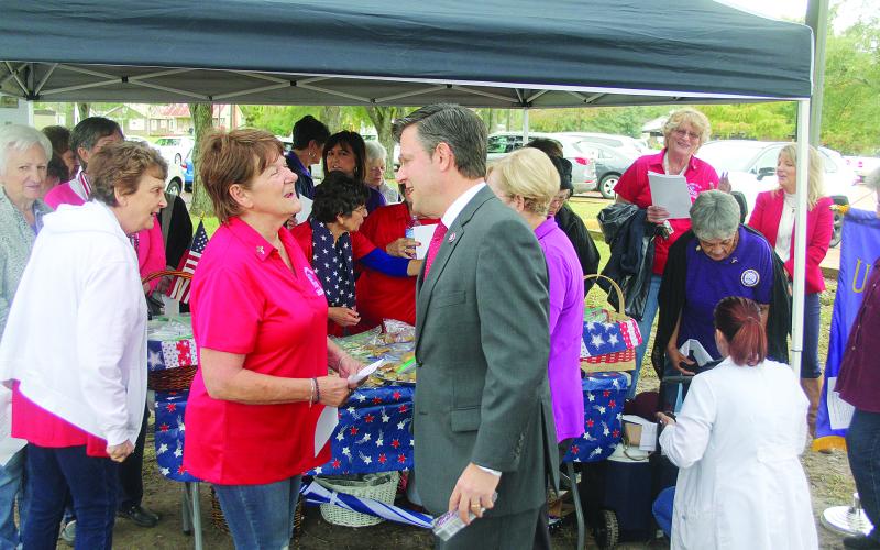 Congressman Mike Johnson (right) visits with local Catholic Daughters of America Regent Fannie Soileau outside the Evangeline Parish Courthouse on Thursday, November 11, for Veterans Day. (Gazette photo by Tony Marks)