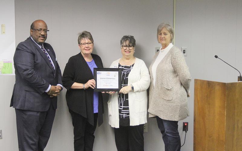From left are Supt. Lazard, Vidrine Elementary Principal Debbie Soileau, LeCompte, and board member Karen Vidrine. (Gazette photo by Tony Marks)