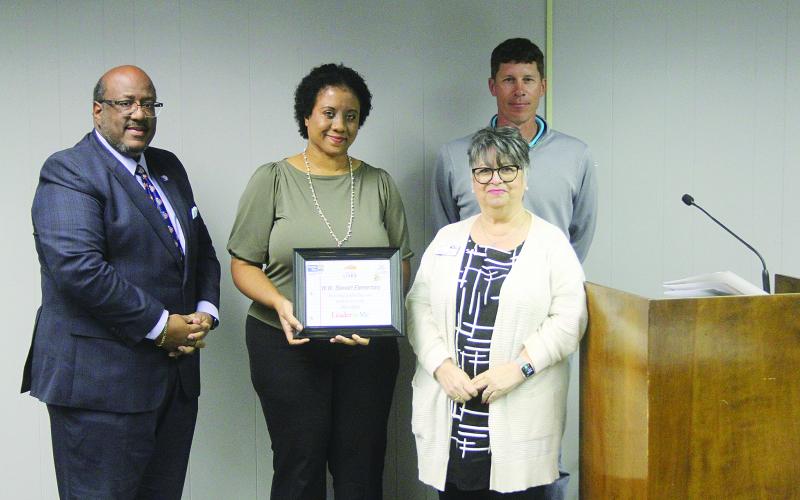 From left are (front row) Supt. Darwan Lazard, W.W. Stewart Elementary Principal Danielle Young, and United Way of St. Landry/Evangeline Director Ginger LeCompte; (back row) board member Nick Chaumont. (Gazette photo by Tony Marks)