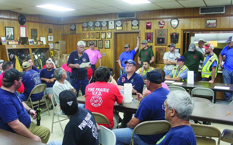 Mamou Fire Chief Garry Reed (center) explains the route and procedures during the water shuttle held Wednesday, October 5. The route went from the Mamou Fire Station to the Mamou rice driers on Old Highway 13. (Gazette photo by Tony Marks)