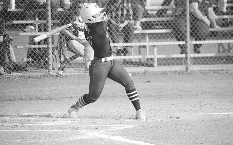 Mamou’s Sarah LaCoste (7) swings at a pitch in her team’s win against Westlake in the first round of the playoffs. (LSN photo by Rhett Manuel)