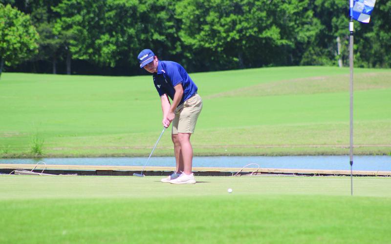 William Chapman is pictured as he tries to make a putt during the first round of the state golf tournament on Monday, May 4, in Carencro. (Gazette photo by Tony Marks)