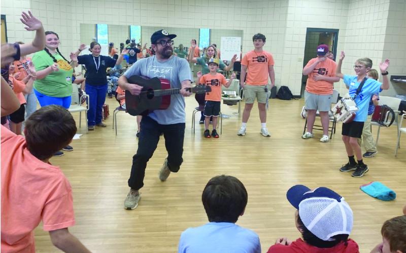 Joseph “Jo” Vidrine is pictured as he inspires youth musicians at Kids’ Camp in Eunice. (Photo by Zeta McCaskill)