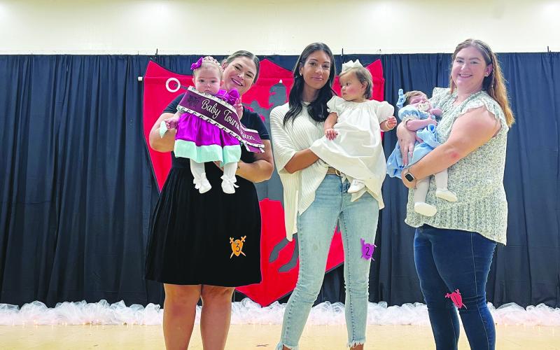 BABY MISS TOURNOI COURT - Shown, from left, are the members of the Baby Miss Tournoi Court. They are Queen August Manuel; Bentley Jo Buller, first runner-up; and Jolie Harbour, second runner-up.