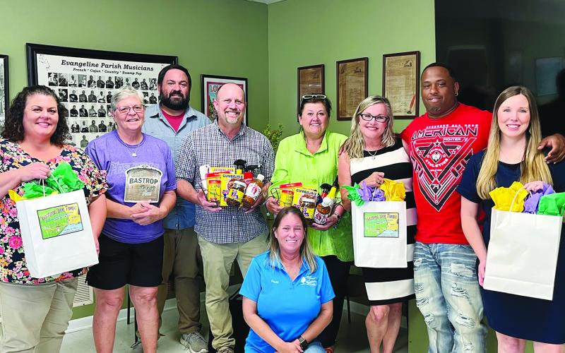 Shown, from left, are EPTC board member Melissa Clavier, EPTC vice president Wanda Verrette, board member Tony Marks, Trey Job with the City of Bastrop, Kathy Danielson with the City of Bastrop, EPTC president Opal Andrus, second vice president Derrell Thomas and EP Tourism Marketing Manager Elizabeth West. Kneeling in front is board member Paula Darbonne. (Photo courtesy of Elizabeth West)