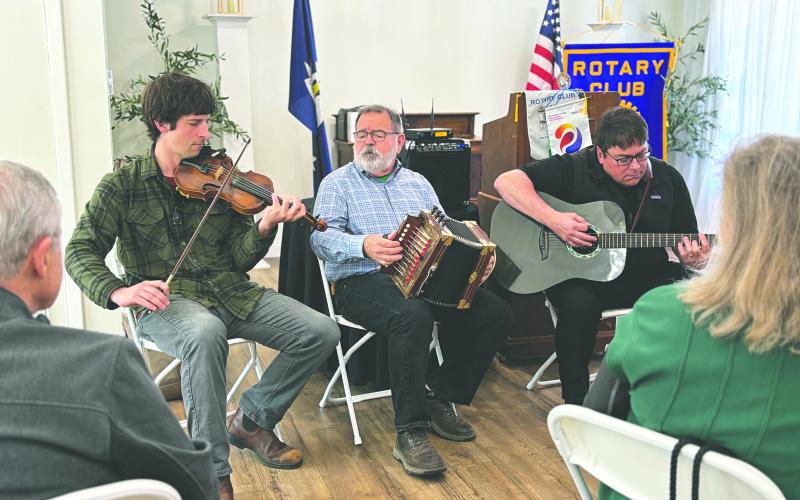 From left, are Colin Gould, John Vidrine and Kevin Huval (president of Louisiana Folk Roots) perform for Rotarians during the March 17, meeting of the Ville Platte Rotary Club. They also shared details on the upcoming Dewey Balfa Cajun and Creole Heritage Week, which will be held April 13-16 at Lakeview Park and Beach. (Gazette photo by Heather Bogard)
