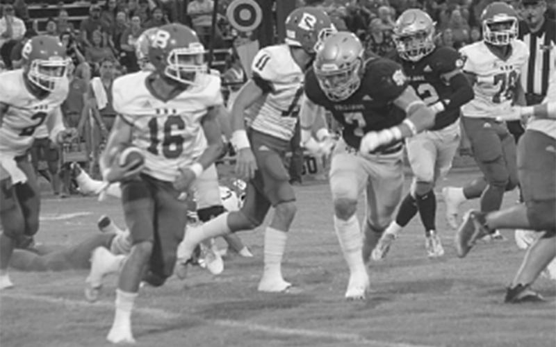 Bearcat Gage Craton (16) attempts to get around Sacred Heart Trojan Cole Tate (7) in non-district play earlier this season. (Gazette photo by Rhett Manuel)