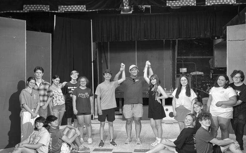 GREASE CAST AT EPT - (left to right, seated) Amelia Bourgeois as Marty, Leo Spell as Sonny, Josephine Ohlenforst as Frenchie, Scarlet Douget as Barbara Jean, and Phillip Cormier as Doody; (standing) Rose Young as Jan, Joe Aucoin as Roger, Laylah Glland as Patty, Tiltie Manuel as Eugene, Bethany Pousson as Cha Cha, Daxton Broussard as Danny Zuko, Gabe Ortego, EPT President, Liana Reed as Sandy, Amelie Fontenot - Ensemble, Deshae Davis as Rizzo, and Hewson Bourgeois as Kenickie.