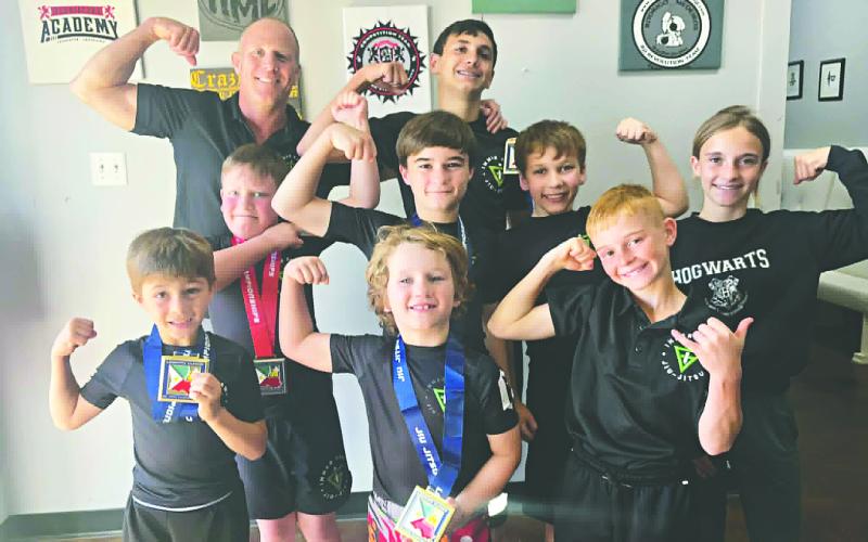 INNER GAME STUDENTS DO WELL IN TOURNAMENT - Several students from Inner Game Jiu-Jitsu participated in a tournament in Lafayette on Saturday, April 11, and had a great showing. Above, Coach Robbie Stevens (top left), Charlie and Leah Stevens (right) and students (in no particular order) Bodhi Vidrine, Oliver Sonnier, Jeremiah Trahan, Kason Castille, Easton Sonnier and Eli Lafleur share a celebratory photo. (Photo courtesy of Robbie Stevens)