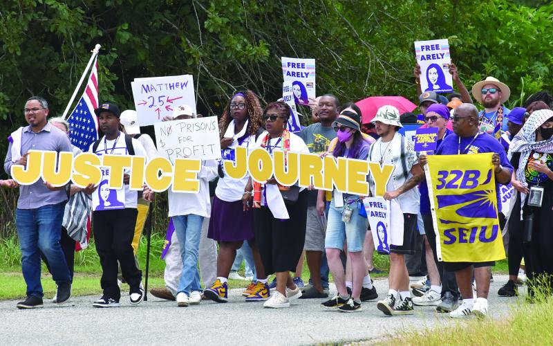 PROTESTORS MARCH AT LOCAL GEO DETENTION CENTER - Joseph Bryant, international executive director of SEIU (far left), was among the 300 that gathered on East Stagg Avenue in front of the local detainee center back in July of this year. (Photo by Robert Stewart, Verite News)