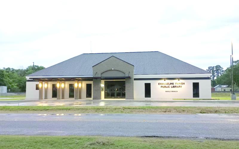 NEW LIBRARY LIGHTS UP -  This photo was taken recently at dusk as lights illuminate the new library in old downtown Basile, which will open to the public on Thursday, June 5, following a 9 a.m. ribbon-cutting ceremony.