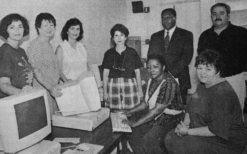 Shown, sitting at the keyboard is Kathy Aclis, lab director. Seated next to her is Janella Vidrine, kindergarten teacher. Standing in back, from left, are Keitha Lejeune, librarian; Janice Soileau, principal; Rosemary Guillory, guidance counselor; Sandra Reed, kindergarten teacher; Superintendent Dr. Albert Zackrie Jr.; and Wesley Dehm, field engineer. (Gazette archive photo)