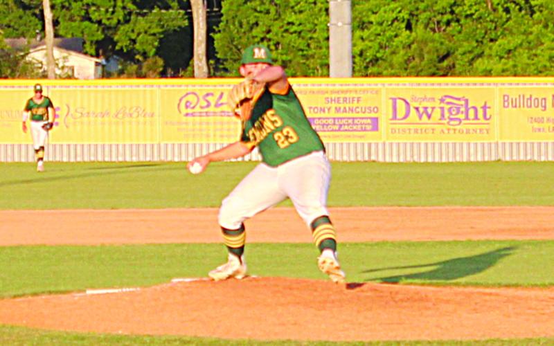 Wyatt Johnson (23) prepares to deliver a pitch in Mamou’s playoff series against Iowa.  (Gazette photo by Rhett Manuel)