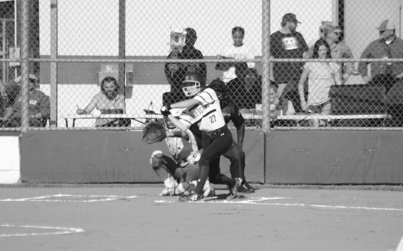 Jennifer Fontenot (27) waits for a pitch to cross home plate in Mamou’s playoff opening win against Springfield. (Gazette photo by Rhett Manuel)