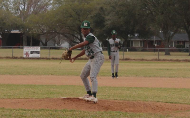 Donovyn Beau Henderson (24) delivers a pitch for Mamou in a loss to Ville Platte High. (Gazette photo by Rhett Manuel)