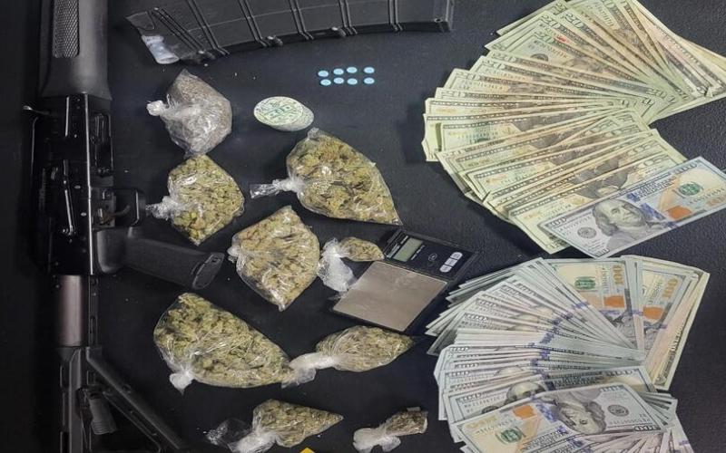 Pictured are a firearm, U.S. currency, and illegal narcotics which were seized following a recent arrest by the Evangeline Parish Sheriff’s Office. (Photo courtesy of EPSO)