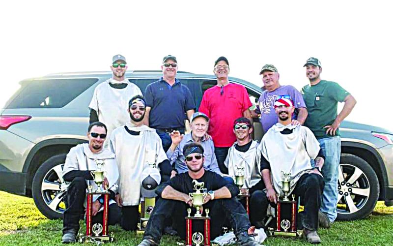 FAMILY SURROUNDS ITS PATRIARCH - Winston Guillory, seated in the center, is surrounded by family at the 2020 Tournoi. Seated in front is John Ross Guillory. Kneeling in the second row, from left, are Alex Haller, Eric Guillory, Winston Guillory, Marcus Guillory, Ryan Haller, and Cody Guillory. Standing in back, from left, are Cody Guillory, Kent Guillory, Kirt Guillory, Keith Guillory and William Fontenot. (Photo submitted)