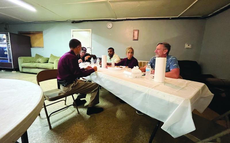 Chief Pat Hall visits with, from left, council members Eugene Manuel and Ricardo “Reko” Goodley, Mayor Leisa Deshotel and council member Robin Young. (Gazette photo by Heather Bogard)