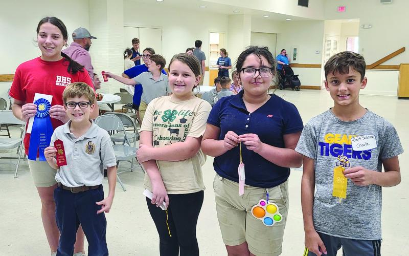 SEAFOOD COOKERY WINNERS - Shown, from left, are winners Anne Berzas (Basile eighth grade), first place; Andrew Bischoff, (Sacred Heart fourth grade), second place; Sophia Aucoin (Vidrine fifth), third place; 4th Gracelynn Derise (Mamou fourth grade); and Rhett Soileau, (Sacred Heart fifth grade), fifth place.
