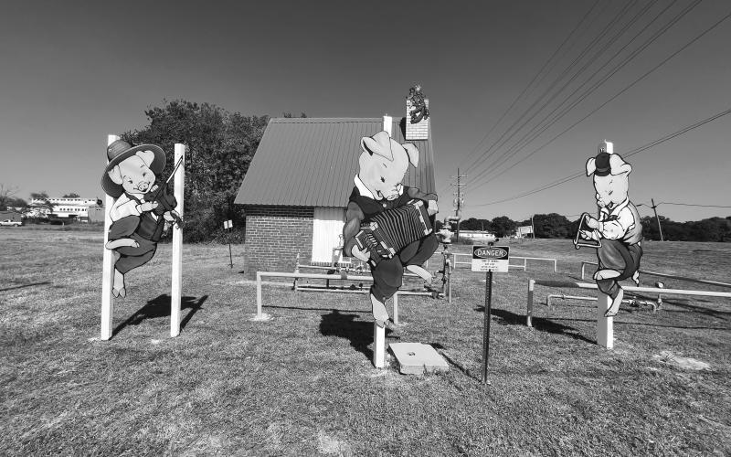 ICONIC MAMOU SCENE RESTORED - In the above photo, the Three Little Pigs are returned to their home to bring joy to the Town of Mamou just in time to celebrated the Mamou Cajun Music Festival in a couple of weeks.