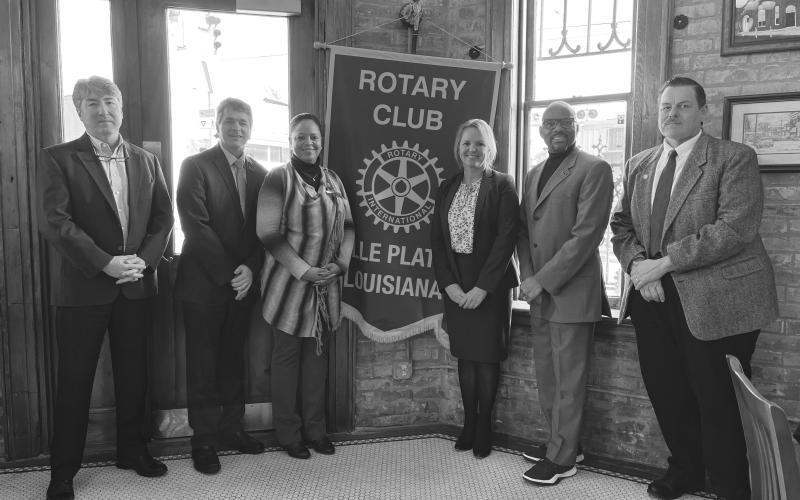 SLCC CHANCELLOR ADDRESSED ROTARY CLUB - Shown, from left, are Rotary President JImmy LeBlanc; Anthony Baham, interim vice president of workforce and economic development; Carleen Jones, C.B. Coreil campus director; Rotarian Nicole Wenger, Dr. June, and Dr. Charles Miller, associate vice chancellor of institutional effectiveness. (Gazette photo by Heather Bogard)