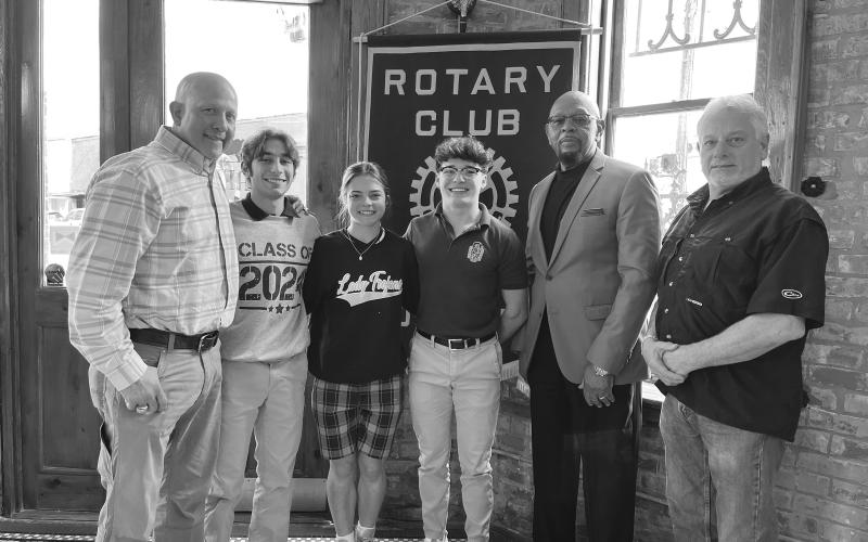 VP ROTARY HEARS FROM SHS POWER LIFTING TEAM - Coach Dwayne Urbina and members of the Sacred Heart High School power lifting team visited the February 7, meeting of the Ville Platte Rotary Club. Shown, from left, are Coach Urbina, Jesse Johnson, Adeline Launey, Jude Hebert, Rotarian Clem Lafleur and Rotary President Larry Lachney (right). (Gazette photo by Heather Bogard)