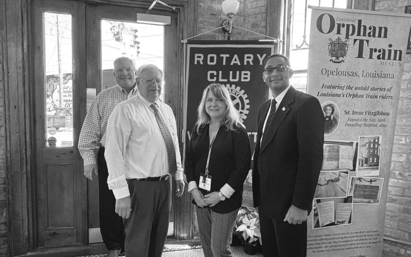 HISTORY OF ORPHAN TRAIN PRESENTED -  Shown, from left, are Rotarians Peter Strawitz, James Douget, Martha Aubert and Rotary President Brian Ardoin.Douget and Aubert with the Orphan Train Museum talked about the history of the Orphan Train. (Gazette photo by Heather Bogard).