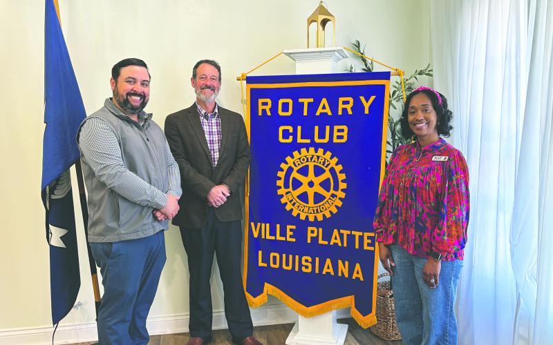 LIBRARY SERVICES SHARED - Keishia Ford, branch manager of the Ville Platte Main Branch of the Evangeline Parish Library, (right) visited the February 24, meeting of the Ville Platte Rotary Club. She is shown with, from left, Rotary President Beau Wilson and Rotarian Richard Lejeune. (Gazette photo by Heather Bogard)