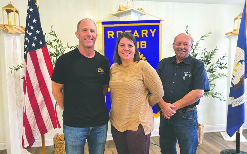 JIU-JITSU GYM OWNER SHARES PASSION FOR SPORT - Robbie Stevens (left) shared his passion for Brazilian Jiu-Jitsu during the February 25, meeting of the Ville Platte Rotary Club. He is shown with Rotarian Kristi Enicke (center) and Rotary President Bob Manuel (right) (Gazette photo by Heather Bogard)