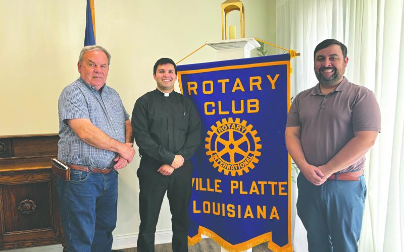 SEMINARIAN FORMATION DISCUSSED - Father Alex Lancon (center) was the guest speaker for the March 24, meeting of the Ville Platte Rotary Club. He is shown with Rotarian Steve Phillips (left) and Rotary President Beau Wilson (right). (Gazette photo by Heather Bogard)