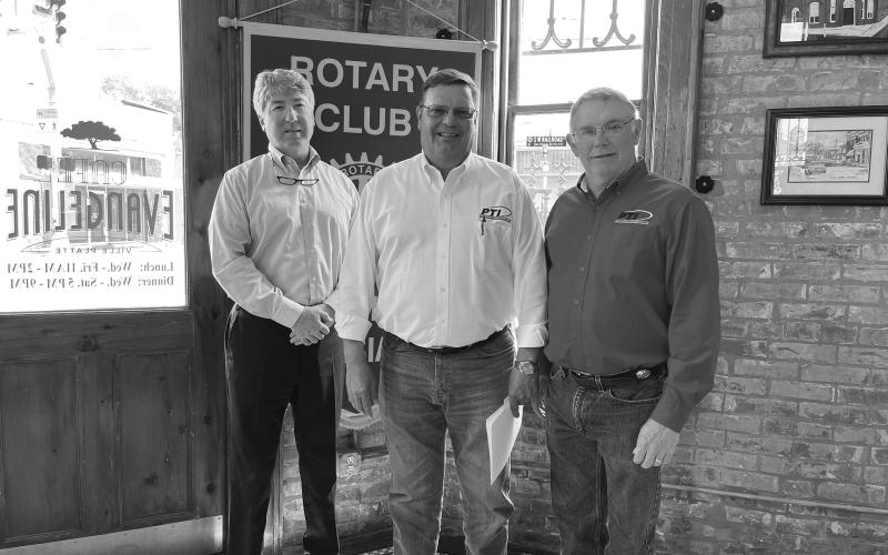LATOUR DISCUSSES BUSINESS - Bart LaTour with Progressive Tractor addressed the March 29, meeting of the Ville Platte Rotary Club. He is shown with Rotary President Jimmy LeBlanc (left) and Rotarian Mitch Fontenot (center). (Gazette photo by Heather Bogard)