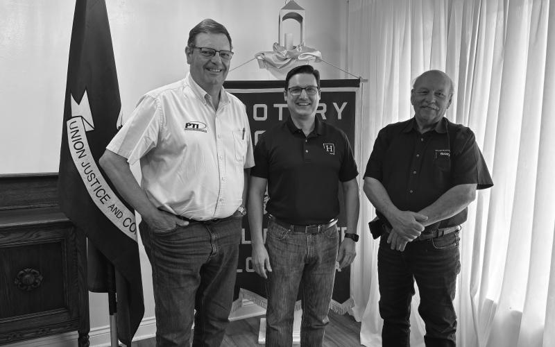 MEDICARE OPTIONS DISCUSSED - Tony Palumbo (center) shared important information on available Medicare options during the April 1, meeting of the Ville Platte Rotary Club. He is shown with Rotarian Mitch Fontenot (left) and Rotary President Bob Manuel (right). (Gazette photo by Heather Bogard)