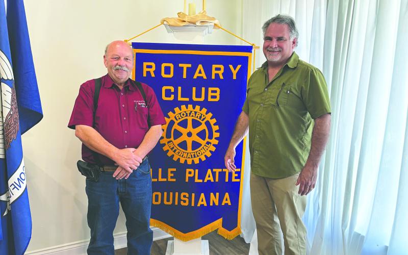 INFORMATION ON FORTIFIED ROOFS SHARED - Rotarian Eric Gil, during the April 15, meeting of the Ville Platte Rotary Club, shared information of the costs and insurance savings of fortified roofs for homeowners. He is shown with Rotary President Bob Manuel (left) (Gazette photo by Heather Bogard)