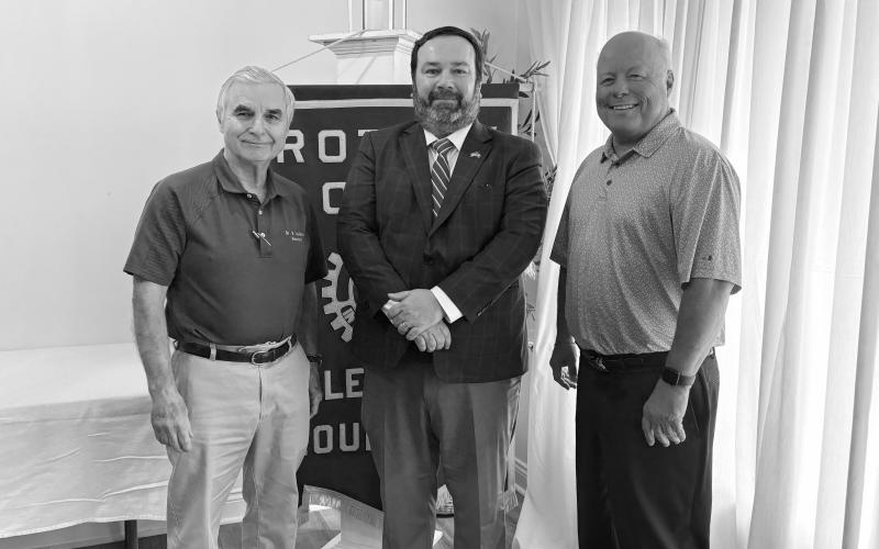 During the April 21, meeting, Assistant District Attorney Jacob Fusilier visited with the members and shared an update on the office. He is shown with Rotarians Dr. Kirk Soileau (left) and Dr. Hosea “Joey” Soileau (right). (Gazette photos by Tony Marks and Heather Bogard)