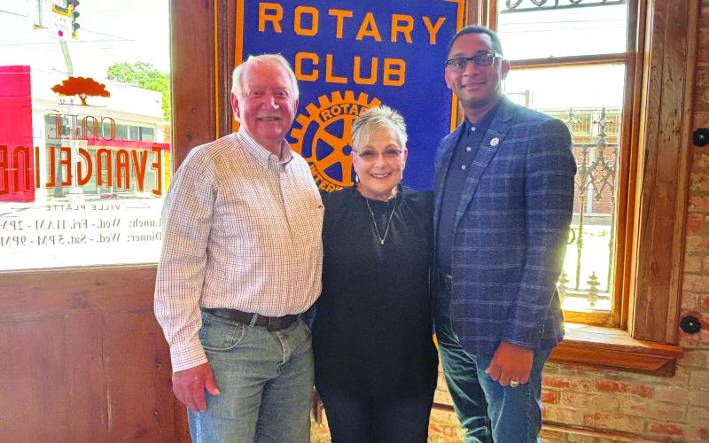 SILVER EAGLE SOCIALS DISCUSSED -  Shown, from left, are Rotarian Brent Coreil, Silver Eagles President Rhonda Lafleur and Rotary President Brian Ardoin. (Gazette photo by Heather Bogard)