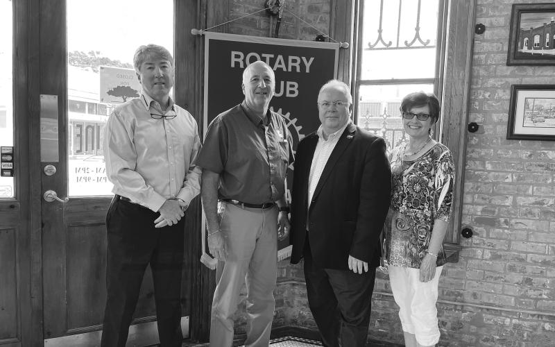 STATE OF LOCAL ECONOMY DISCUSSED - Dr. Randall Dupont, dean of the College of Business at LSU-Alexandria, gave an update on the local and state economy during the May 10, meeting of the Ville Platte Rotary Club. Shown, from left, are Rotary President Jimmy LeBlanc, Marty Morein, Dr. Dupont and Rotarian Annette Johnson. (Gazette photo by Heather Bogard)