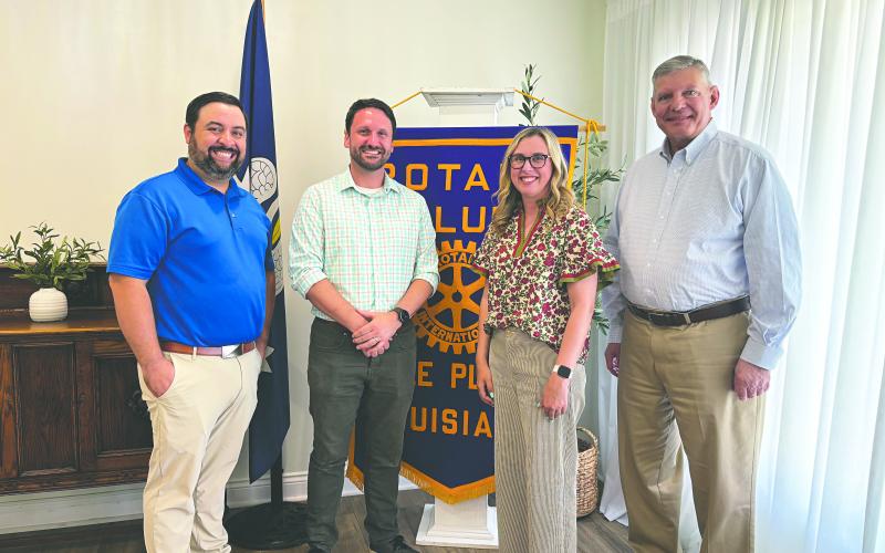 NEW BOOKSTORE TO OPEN IN VILLE PLATTE - Seth and Jessica Deen Norris (center) visited the May 12, meeting of the Ville Platte Rotary Club to share their journey to opening a new bookstore in town. Rotary President Beau Wilson (left) and Rotarian Peter Strawitz (right). (Gazette photo by Heather Bogard)