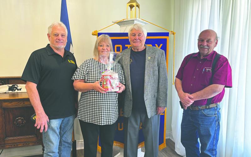 ROTARIANS HEAR FROM BOMB EXPERT - During the May 13, meeting of the Ville Platte Rotary Club, John Miller Jr. discussed his career in Arkansas as a bomb squad technician with the Fort Smith Police Department and Arkansas State Police Special Operations division. Shown, from left, are Rotarian Larry Lachney, Dottie Miller, John Miller Jr. and Rotary President Bob Manuel. (Gazette photo by Heather Bogard)