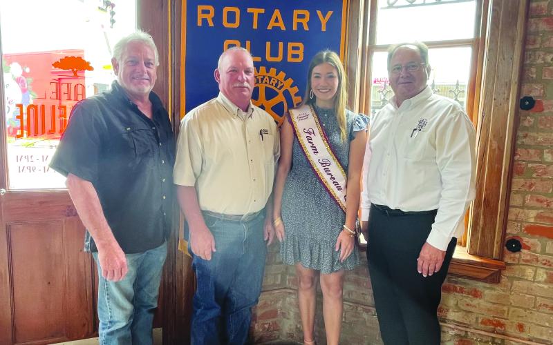 DESHOTEL DISCUSSES AGRICULTURE - New Evangeline Parish County Agent Vince Deshotel (second from left), along with his daughter Emily Deshotel, gave an update on agriculture and 4-H in Evangeline Parish during the May 30, meeting of the Ville Platte Rotary Club. They are shown with Rotary President Larry Lachney (left) and Rotarian Wayne Vidrine (right). (Gazette photo by Heather Bogard)