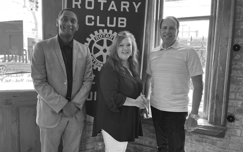 LAMKE GIVES UPDATE ON FOUNDATION - Connie Acosta Lamke (center) gave an update on the Acosta Foundation and work at the Aswell House during the June 27, meeting of the Ville Platte Rotary Club. She is shown with Rotary President Brian Ardoin (left) and Rotarian Darin Bordelon (right).