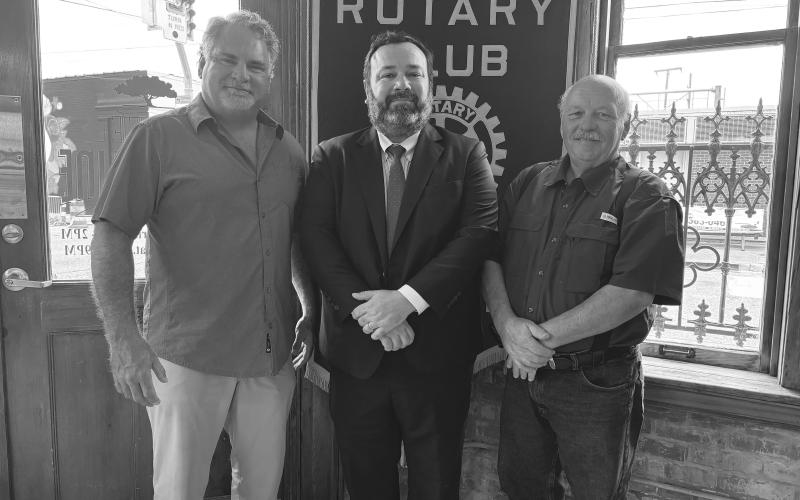 VP ATTORNEY SHARES UPDATE -  Attorney Jacob Fusilier (center) addressed the July 2, meeting of the Ville Platte Rotary Club. He is shown with Rotarian Eric Gil (left) and Rotary President Bob Manuel (right). (Gazette photo by Heather Bogard)