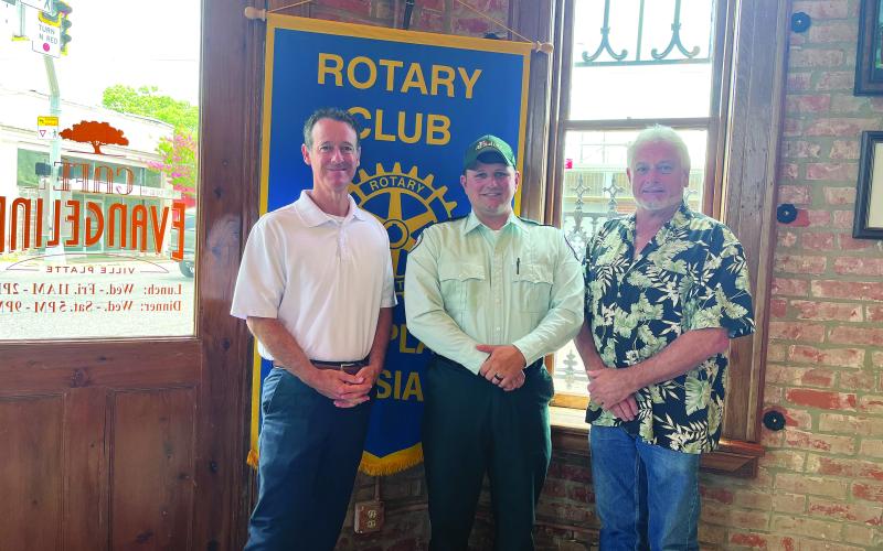 ACADIAN AMBULANCE SERVICES DISCUSSED - Jacques Dupre, center, visited the July 5, meeting of the Ville Platte Rotary Club to discuss his career with Acadian Ambulance. He is shown with Rotarian Richard Lejeune, left, and Rotary President Larry Lachney, right. (Gazette photo by Heather Bogard)