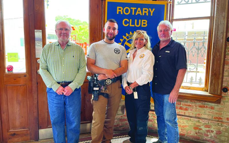 MARSHAL OFFICE DUTIES DISCUSSED - Ville Platte City Marshal Nicole Snoddy (second from right) and deputy Aaron Clark (second from left) visited the July 12, meeting of the Ville Platte Rotary Club to discuss the workings of the city marshal’s office. They are shown with Rotarian Ronnie Landreneau (left) and Rotary President Larry Lachney (right). (Gazette photo by Heather Bogard)