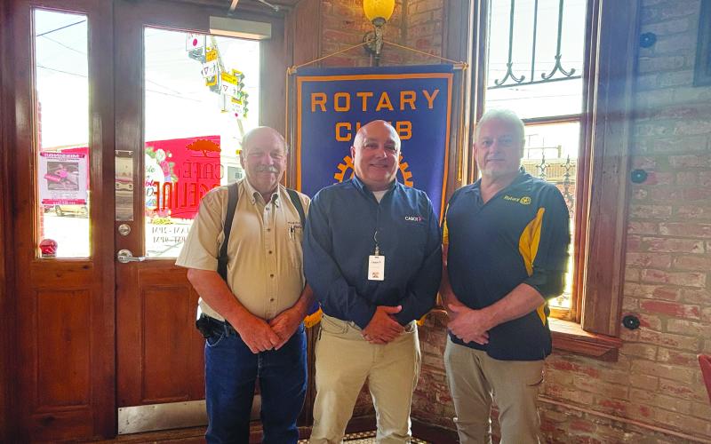 CABOT SHARES PROJECT DETAILS -  Marty Robinson with Cabot (center) addressed the July 9, meeting of the Ville Platte Rotary Club. He is shown with Rotary President Bob Manuel (left) and Rotarian Larry Lachney (right). (Gazette photo by Heather Bogard)