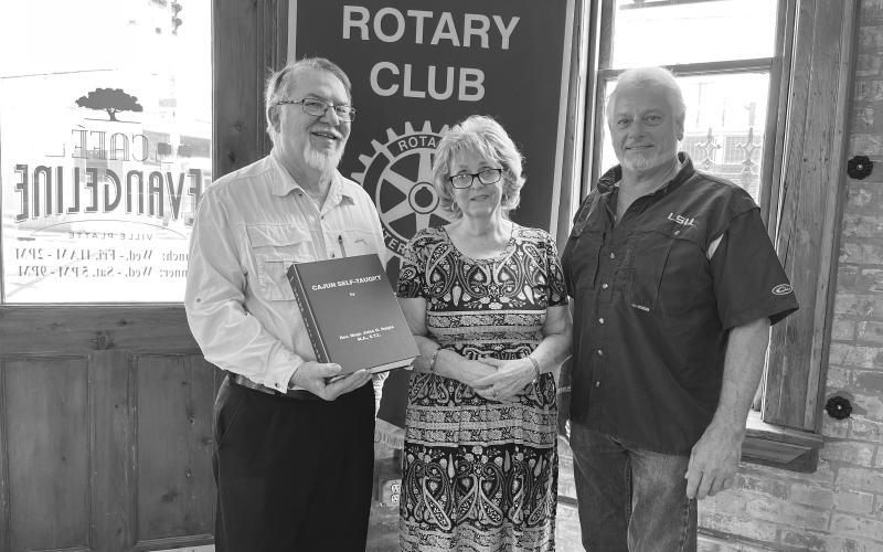 FRENCH ROUND TABLE MEETS - Jackie Miller visited the July 19, meeting of the Ville Platte Rotary Club to discuss the French Round Table held on Monday afternoons at Hundredfold Coffee. She is shown with Rotarian Dan Poret (left) and Rotary President Larry Lachney (right). (Gazette photo by Heather Bogard)