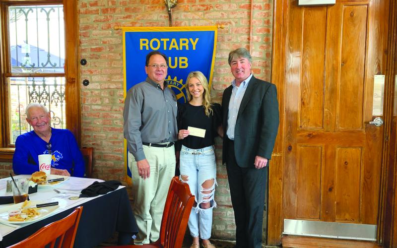 VP ROTARY PRESENTS SCHOLARSHIP - Catherine Fontenot was presented with the RYLA scholarship during the July 27, meeting of the Ville Platte Rotary Club. She is shown with board member Wayne Vidrine, left, and Rotary President Jimmy LeBlanc, right.