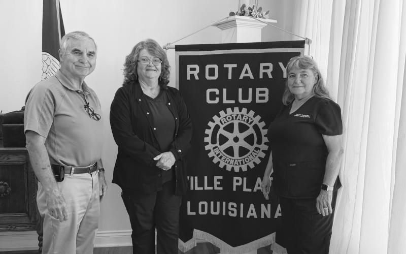 NURSING HOME ADMISSIONS ADDRESSED - During the July 28, meeting of the Ville Platte Rotary Club, Melanie Wolff, admissions coordinator at Heritage Manor Nursing Home, was the guest of Rotarian Patricia Duplechin (right). They are shown with Rotary President Dr. Kirk Soileau (left). (Gazette photo by Heather Bogard)